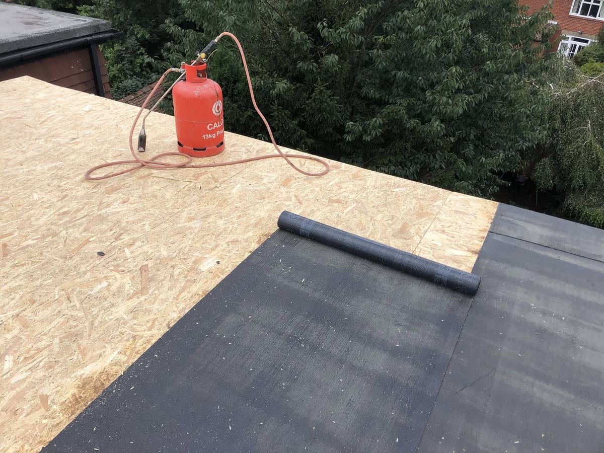 Flat roofing installation in Bradford using torch-on felt over new decking